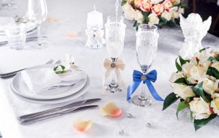 plate at the wedding table with glass on white FTMYHZD